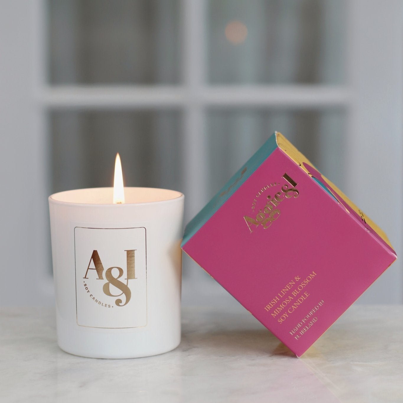 Irish Linen and Mimosa Blossom Luxury Soy Candle by Aggie & I, hand-poured with fresh floral notes of mimosa, violet, and lily, creating a luxurious and uplifting fragrance for your home

